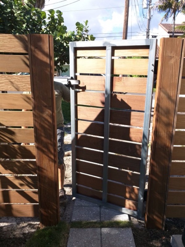 strong metal and wood fence and gate in broward
