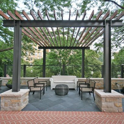 simple metal pergola with chairs and table